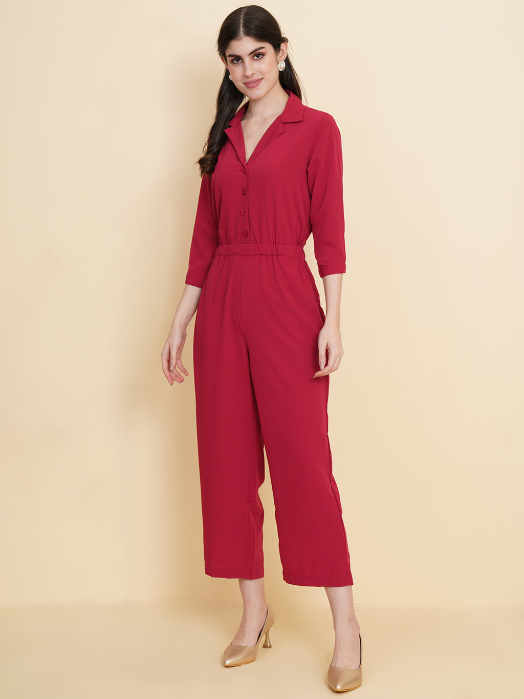 Get ready to make a bold statement with our black formal jumpsuit for women! Tailored in crepe, it features a coat collar with front buttoning and elasticated waist and two side pockets to slip in your essentials. This elegant piece combines sleekness and sophistication, perfect for official and casual wear.