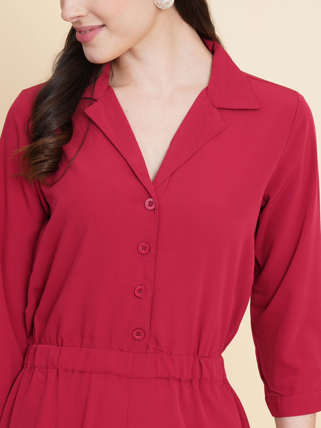 Get ready to make a bold statement with our black formal jumpsuit for women! Tailored in crepe, it features a coat collar with front buttoning and elasticated waist and two side pockets to slip in your essentials. This elegant piece combines sleekness and sophistication, perfect for official and casual wear.