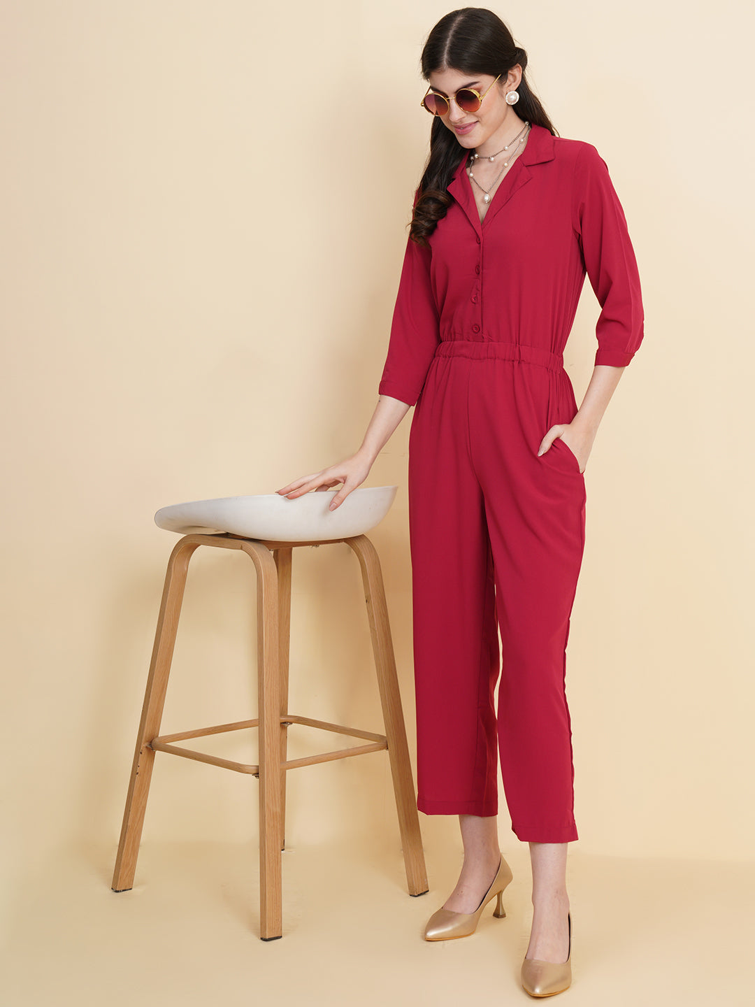 Get ready to make a bold statement with our black formal jumpsuit for women! Tailored in crepe, it features a coat collar with front buttoning and elasticated waist and two side pockets to slip in your essentials. This elegant piece combines sleekness and sophistication, perfect for official and casual wear.
