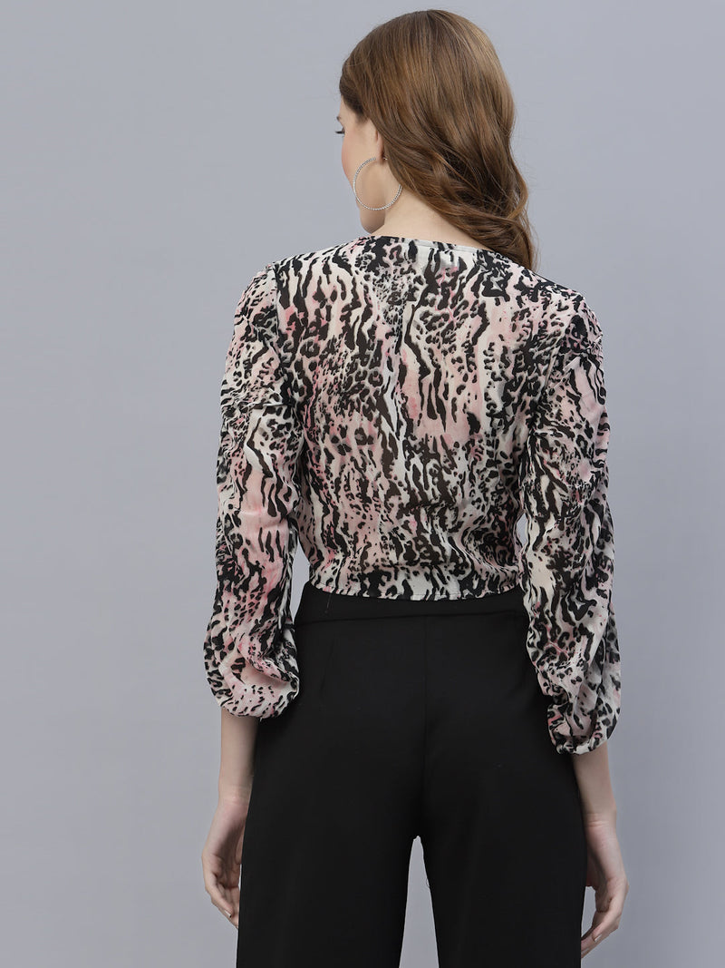 An animal printed pink ruched crop top for women is a trendy and stylish garment that can add a bold statement to your wardrobe. The animal print adds a wild touch to the design, while the ruched detailing creates a flattering and feminine silhouette. The crop top is perfect for a night out or a casual day look, depending on how you style it.