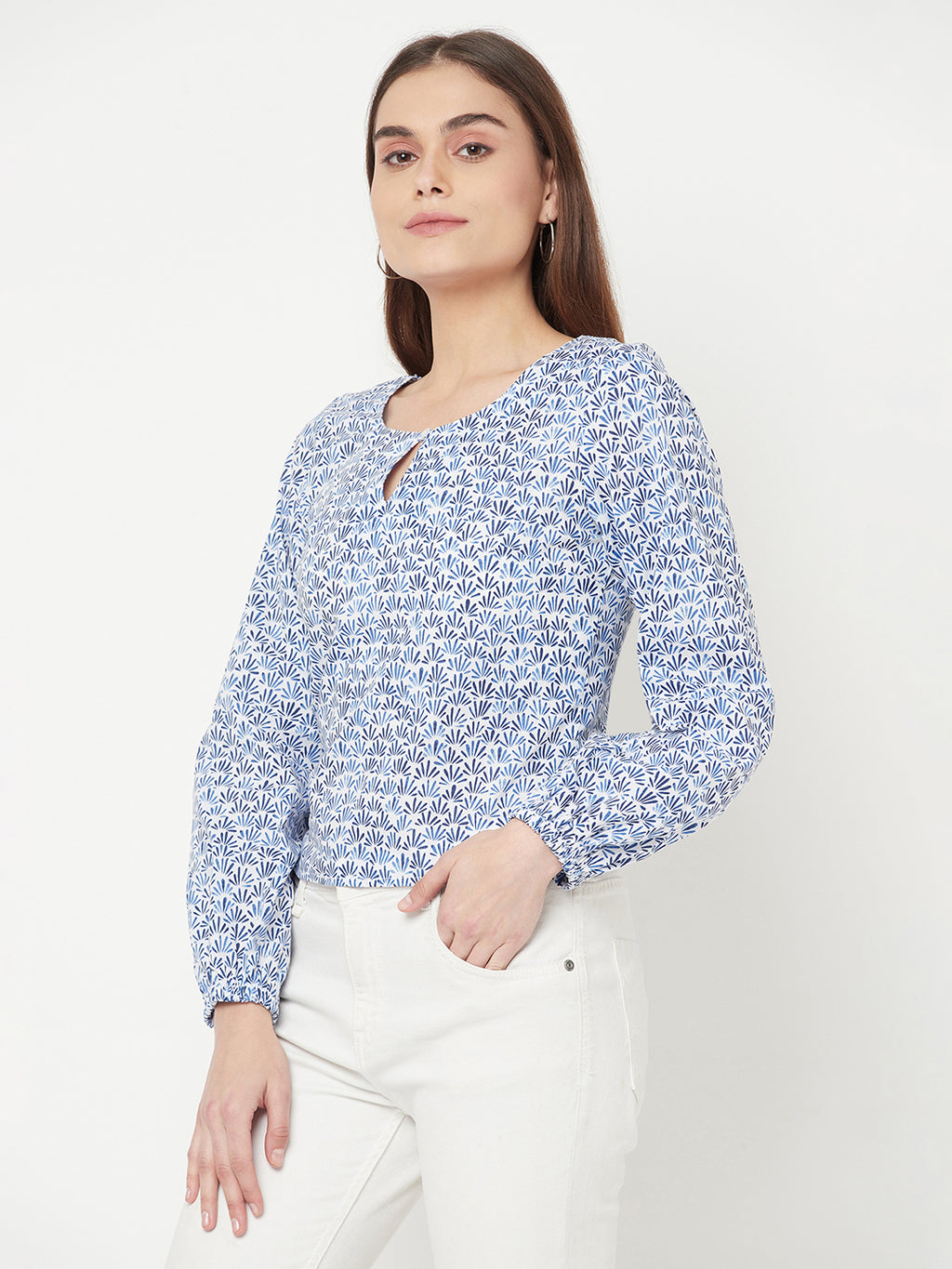 A Cotton Printed Top with Full Sleeve and Keyhole Neck is a comfortable and stylish choice for casual or semi-formal occasions. The top is made of breathable cotton material, which makes it perfect for all-day wear. The printed design adds a pop of color and pattern to the top, making it easy to pair with various bottoms.