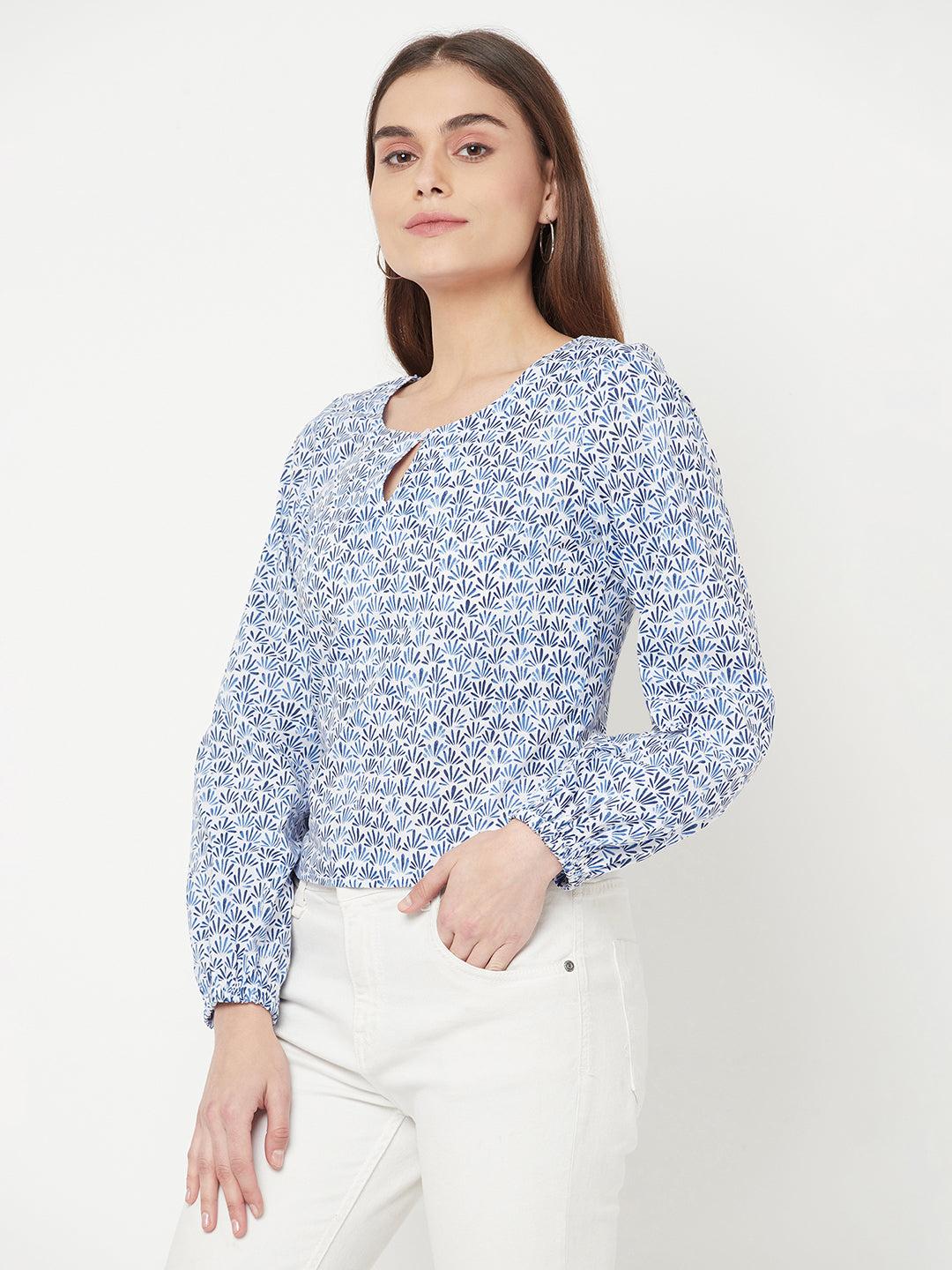 A Cotton Printed Top with Full Sleeve and Keyhole Neck is a comfortable and stylish choice for casual or semi-formal occasions. The top is made of breathable cotton material, which makes it perfect for all-day wear. The printed design adds a pop of color and pattern to the top, making it easy to pair with various bottoms.