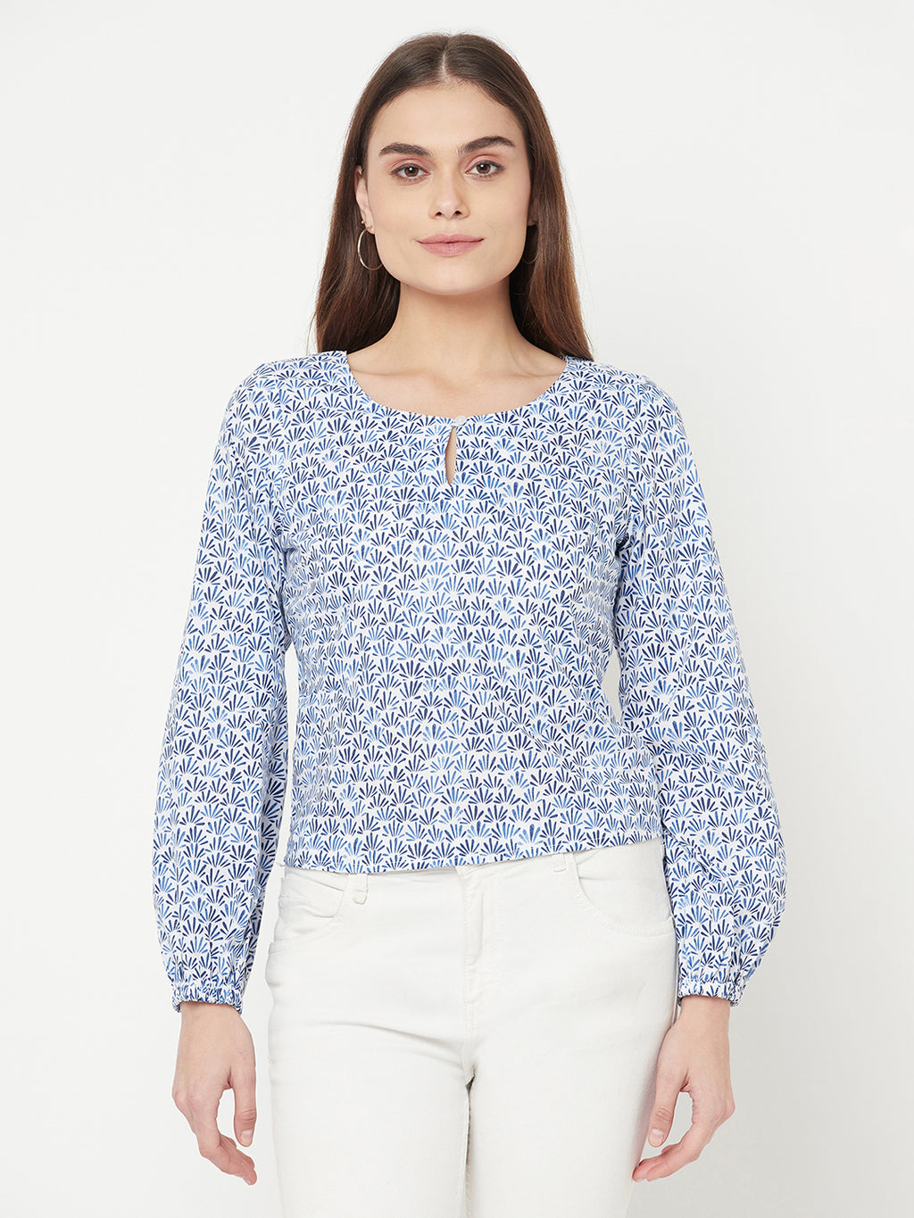 A Cotton Printed Top with Full Sleeve and Keyhole Neck is a comfortable and stylish choice for casual or semi-formal occasions. The top is made of breathable cotton material, which makes it perfect for all-day wear. The printed design adds a pop of color and pattern to the top, making it easy to pair with various bottoms.