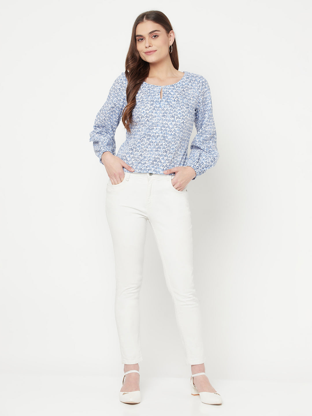 A Cotton Printed Top with Full Sleeve and Keyhole Neck is a comfortable and stylish choice for casual or semi-formal occasions. The top is made of breathable cotton material, which makes it perfect for all-day wear. The printed design adds a pop of color and pattern to the top, making it easy to pair with various bottoms.