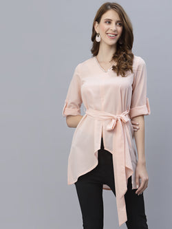 A Peach Color V Neck High Low Top With Belt is a stylish and fashionable garment that can be worn for various occasions. The top features a v-neckline, which creates a flattering and feminine look. The high low hemline adds a trendy touch to the design, making it perfect for a night out or a casual day look. The top also comes with a belt that cinches in the waist, creating a more defined silhouette.