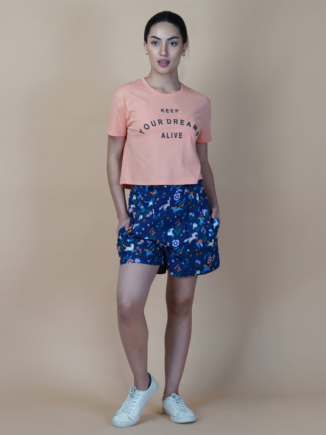 Blue cotton printed shorts for women with side pockets are a perfect addition to your summer wardrobe. These shorts are designed to provide comfort and style during hot weather.  The blue print adds a touch of femininity to the design, making it an ideal choice for those who want to look and feel their best. The shorts come with a side pocket, which is not only functional but also adds a trendy look to the overall design.