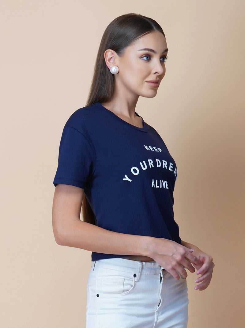 The  blue quote T shirt for women in black color is a stylish and comfortable piece of clothing designed for the modern woman. The shirt features a simple yet impactful quote printed in bold white letters on the front. The black color of the shirt is versatile and easy to pair with different outfits, making it a great addition to any wardrobe.