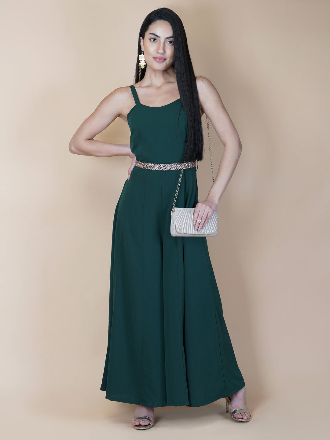 Elevate your style game with our stunning green fit and flare jumpsuit for women! This head-turning piece features a beautifully seerate embellished belt that cinches your waist and adds a touch of glamour.   Zip Closure at Back & 2 side Pockets to slip in your valuables !   Fabric : Crepe  Colour : Bottle Green