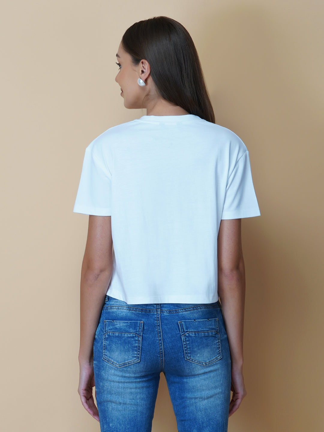 A quote T-shirt for women in white color is the perfect addition to any fashion-conscious woman's wardrobe. Made from soft and comfortable fabric, this T-shirt is designed to provide a relaxed fit and a comfortable feel. The white color of the shirt makes you stand out, and is an ideal choice for those who love to express their femininity peacefully yet stylish way.