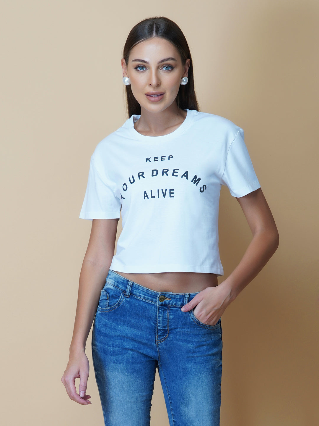 A quote T-shirt for women in white color is the perfect addition to any fashion-conscious woman's wardrobe. Made from soft and comfortable fabric, this T-shirt is designed to provide a relaxed fit and a comfortable feel. The white color of the shirt makes you stand out, and is an ideal choice for those who love to express their femininity peacefully yet stylish way.
