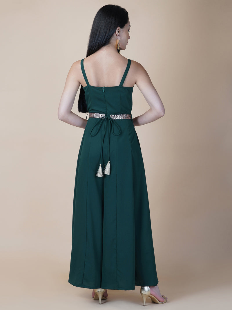 Elevate your style game with our stunning green fit and flare jumpsuit for women! This head-turning piece features a beautifully seerate embellished belt that cinches your waist and adds a touch of glamour.   Zip Closure at Back & 2 side Pockets to slip in your valuables !   Fabric : Crepe  Colour : Bottle Green