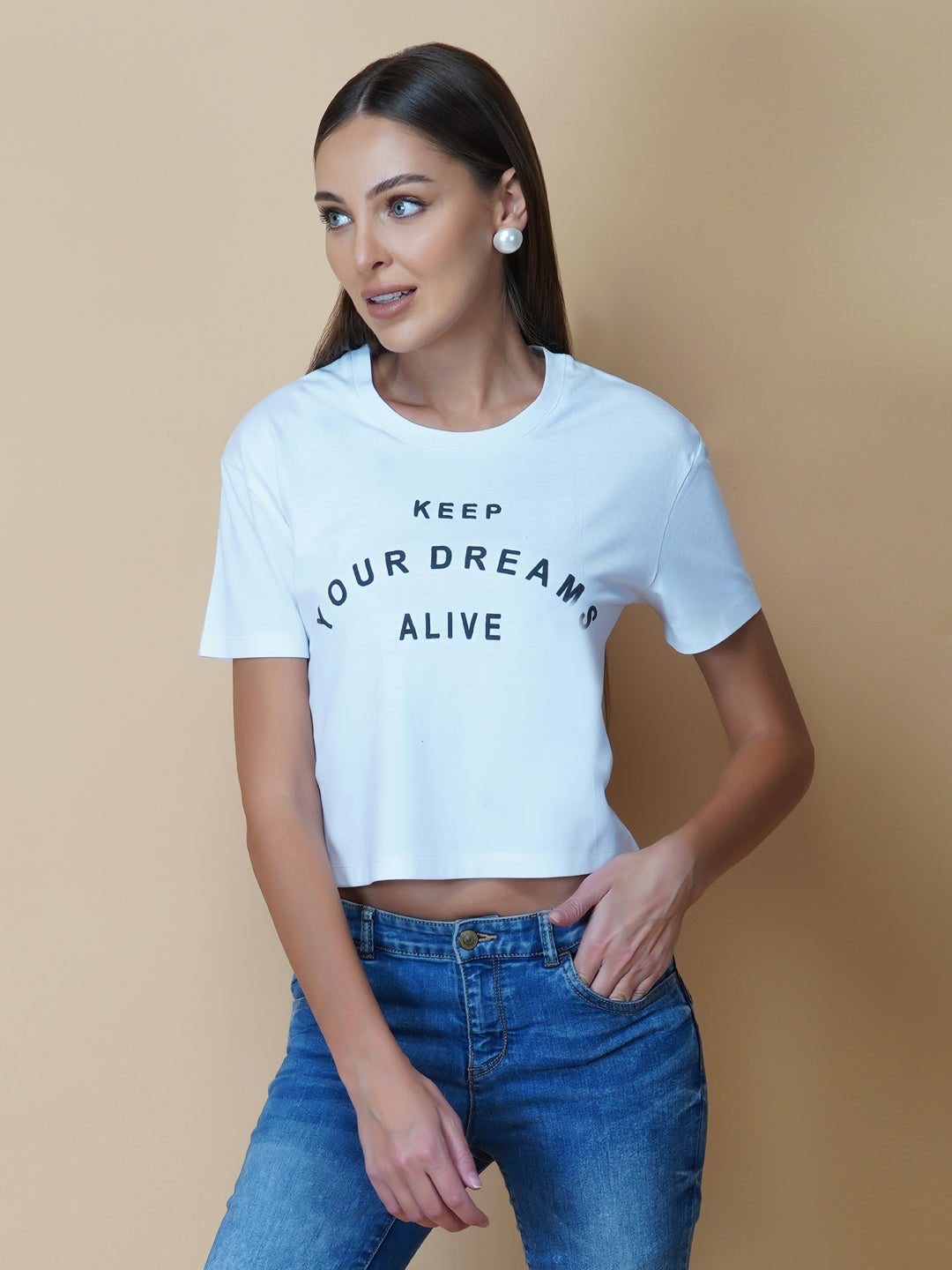 A quote T-shirt for women in white color is the perfect addition to any fashion-conscious woman's wardrobe. Made from soft and comfortable fabric, this T-shirt is designed to provide a relaxed fit and a comfortable feel. The white color of the shirt makes you stand out, and is an ideal choice for those who love to express their femininity peacefully yet stylish way.