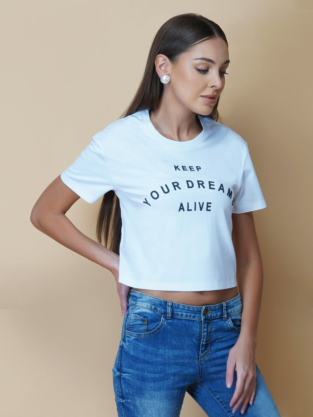 A quote T-shirt for women in white color is the perfect addition to any fashion-conscious woman's wardrobe. Made from soft and comfortable fabric, this T-shirt is designed to provide a relaxed fit and a comfortable feel. The white color of the shirt makes you stand out, and is an ideal choice for those who love to express their femininity peacefully yet stylish way.