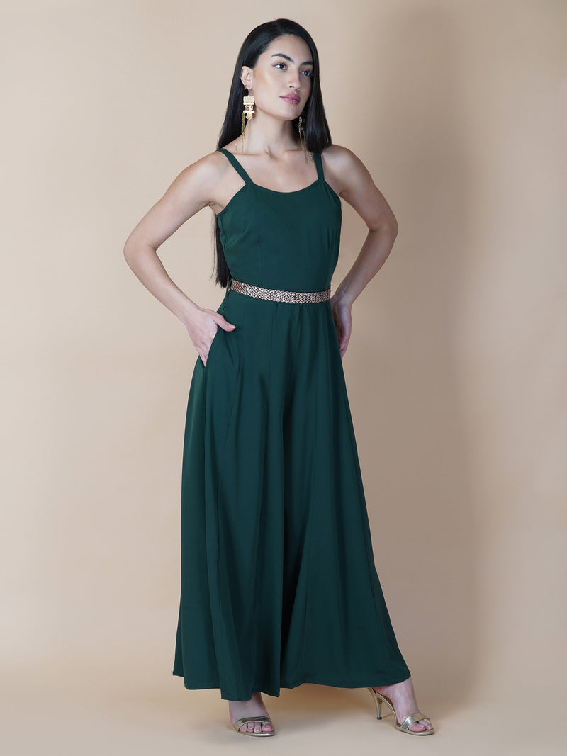 Elevate your style game with our stunning green fit and flare jumpsuit for women! This head-turning piece features a beautifully seerate embellished belt that cinches your waist and adds a touch of glamour.   Zip Closure at Back & 2 side Pockets to slip in your valuables !   Fabric : Crepe  Colour : Bottle Green