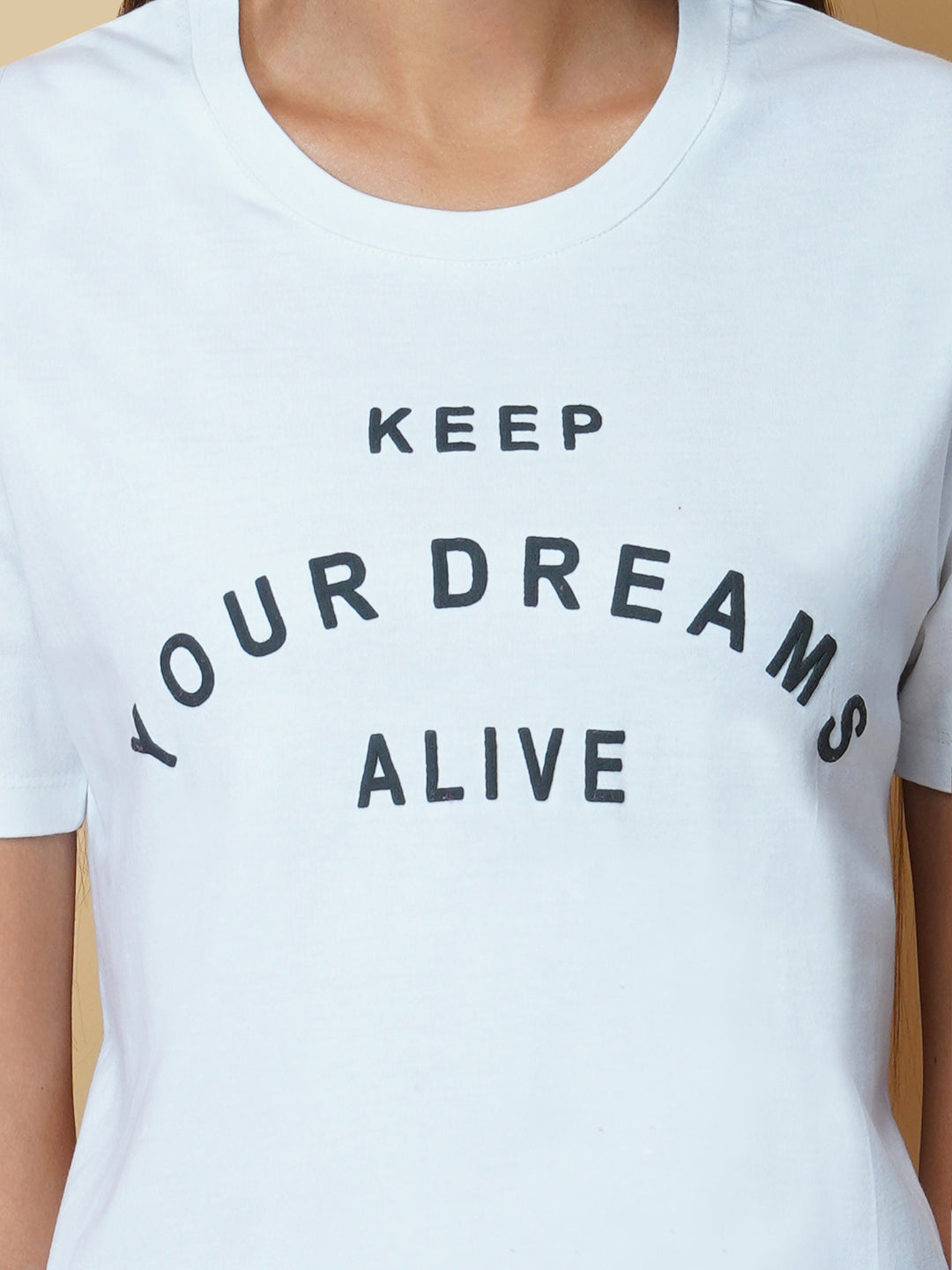 A quote T-shirt for women in white color is the perfect addition to any fashion-conscious woman's wardrobe. Made from soft and comfortable fabric, this T-shirt is designed to provide a relaxed fit and a comfortable feel. The white color of the shirt makes you stand out, and is an ideal choice for those who love to express their femininity peacefully yet stylish way.