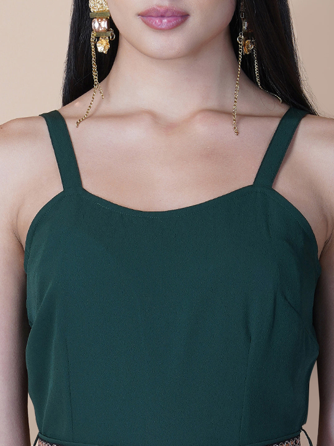 Elevate your style game with our stunning green fit and flare jumpsuit for women! This head-turning piece features a beautifully seerate embellished belt that cinches your waist and adds a touch of glamour.   Zip Closure at Back & 2 side Pockets to slip in your valuables !   Fabric : Crepe  Colour : Bottle Green