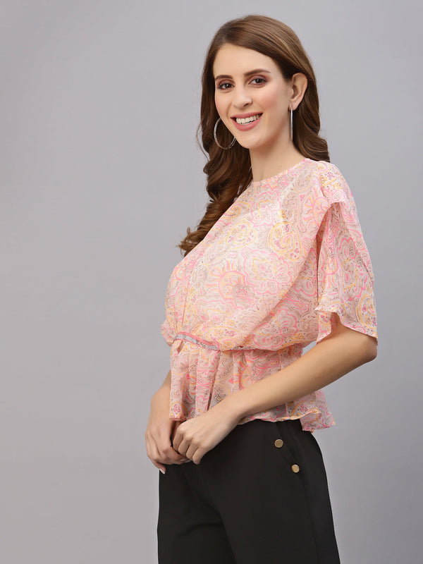 This top features a lightweight and flowy chiffon material that drapes beautifully over the body. The oversized design allows for a comfortable and relaxed fit, while the attached cami provides extra coverage and support. The embellished waist band adds a touch of sparkle and elegance, accentuating the waistline and creating a flattering silhouette. This top is perfect for a variety of occasions, from casual outings to formal events. Pair it with skinny jeans and heels for a chic and stylish look.