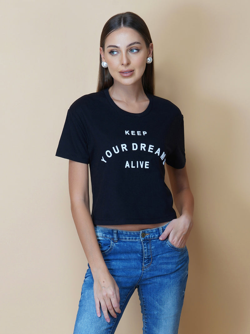 The Quote T shirt for women in black color is a stylish and comfortable piece of clothing designed for the modern woman. The shirt features a simple yet impactful quote printed in bold white letters on the front. The black color of the shirt is versatile and easy to pair with different outfits, making it a great addition to any wardrobe.