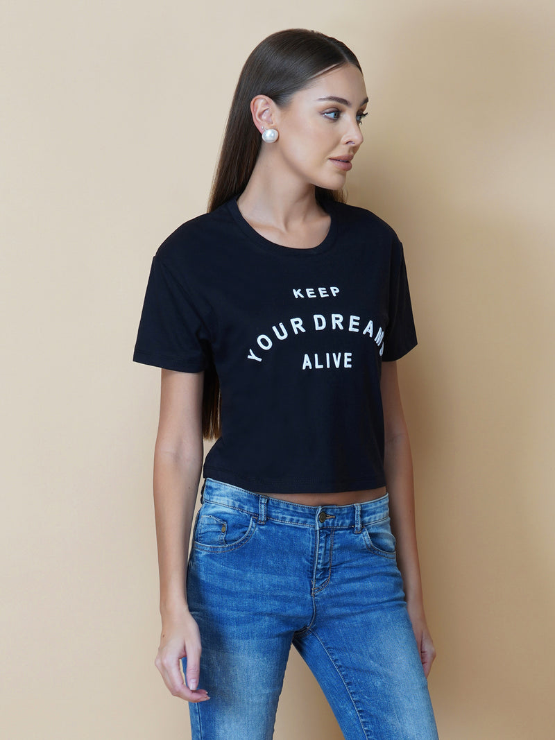 The Quote T shirt for women in black color is a stylish and comfortable piece of clothing designed for the modern woman. The shirt features a simple yet impactful quote printed in bold white letters on the front. The black color of the shirt is versatile and easy to pair with different outfits, making it a great addition to any wardrobe.