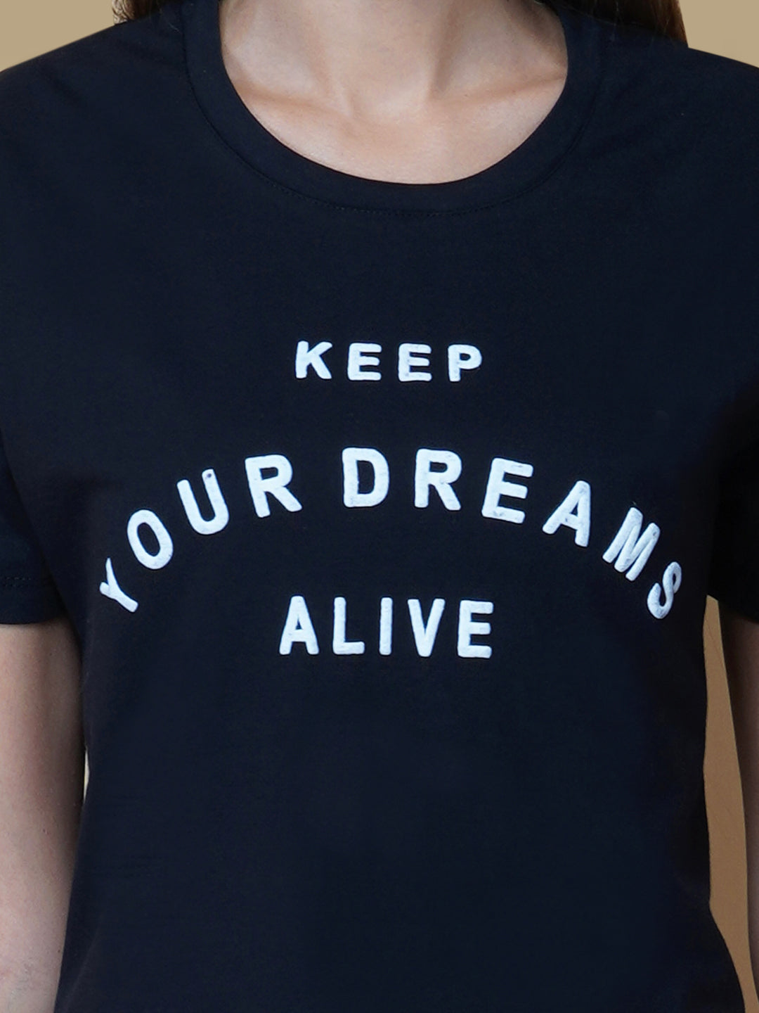 The Quote T shirt for women in black color is a stylish and comfortable piece of clothing designed for the modern woman. The shirt features a simple yet impactful quote printed in bold white letters on the front. The black color of the shirt is versatile and easy to pair with different outfits, making it a great addition to any wardrobe.