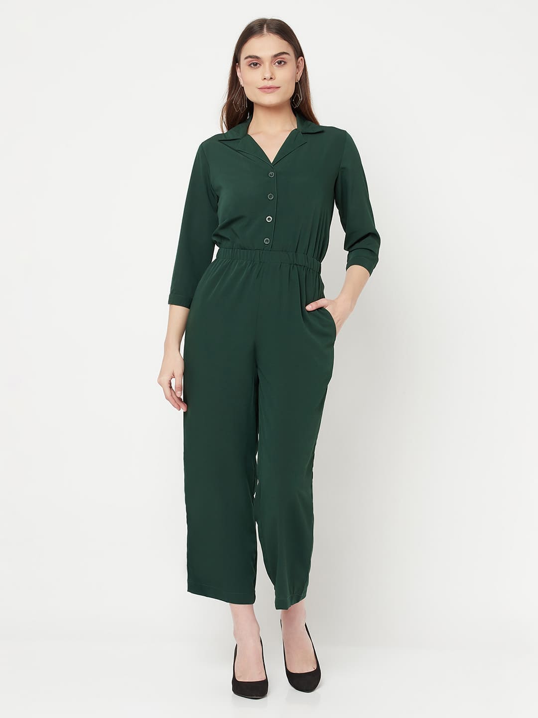 This Green color solid jump suit for women with an elasticated waist is a versatile and stylish piece of clothing that can be dressed up or down for any occasion. It is made of a comfortable and stretchy material that allows for ease of movement, while the elasticated waistband helps to flatter the figure and create a flattering silhouette.