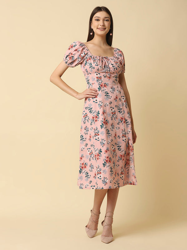This Pink Floral Printed Women Dress In Cotton is a charming and elegant piece that is sure to catch the eye. Made from soft and breathable cotton fabric, it is perfect for warm weather and will keep you comfortable all day long. The dress features a beautiful floral print in shades of pink, white, and green that adds a pop of color to your wardrobe.