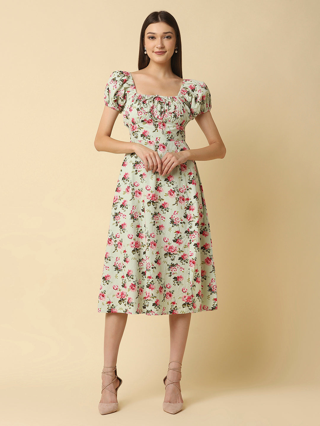 This green floral Printed Women Dress In Cotton is a charming and elegant piece that is sure to catch the eye. Made from soft and breathable cotton fabric, it is perfect for warm weather and will keep you comfortable all day long. The dress features a beautiful floral print in shades of pink, white, and green that adds a pop of color to your wardrobe.  The ruched bust and empire waist create a flattering silhouette that accentuates your curves and adds a feminine touch to the dress. 