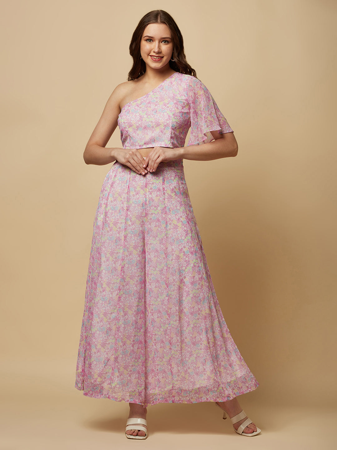 This fashionable co-ord set features a stunning purple floral print, making it the perfect addition to any fashion-forward woman's wardrobe. The set includes a trendy one-shoulder crop top and a pair of flowing palazzo pants.  The top is designed with a single shoulder strap, which adds an edgy and modern touch to the overall look. It also features a fitted bodice, which flatters the silhouette and accentuates the curves.