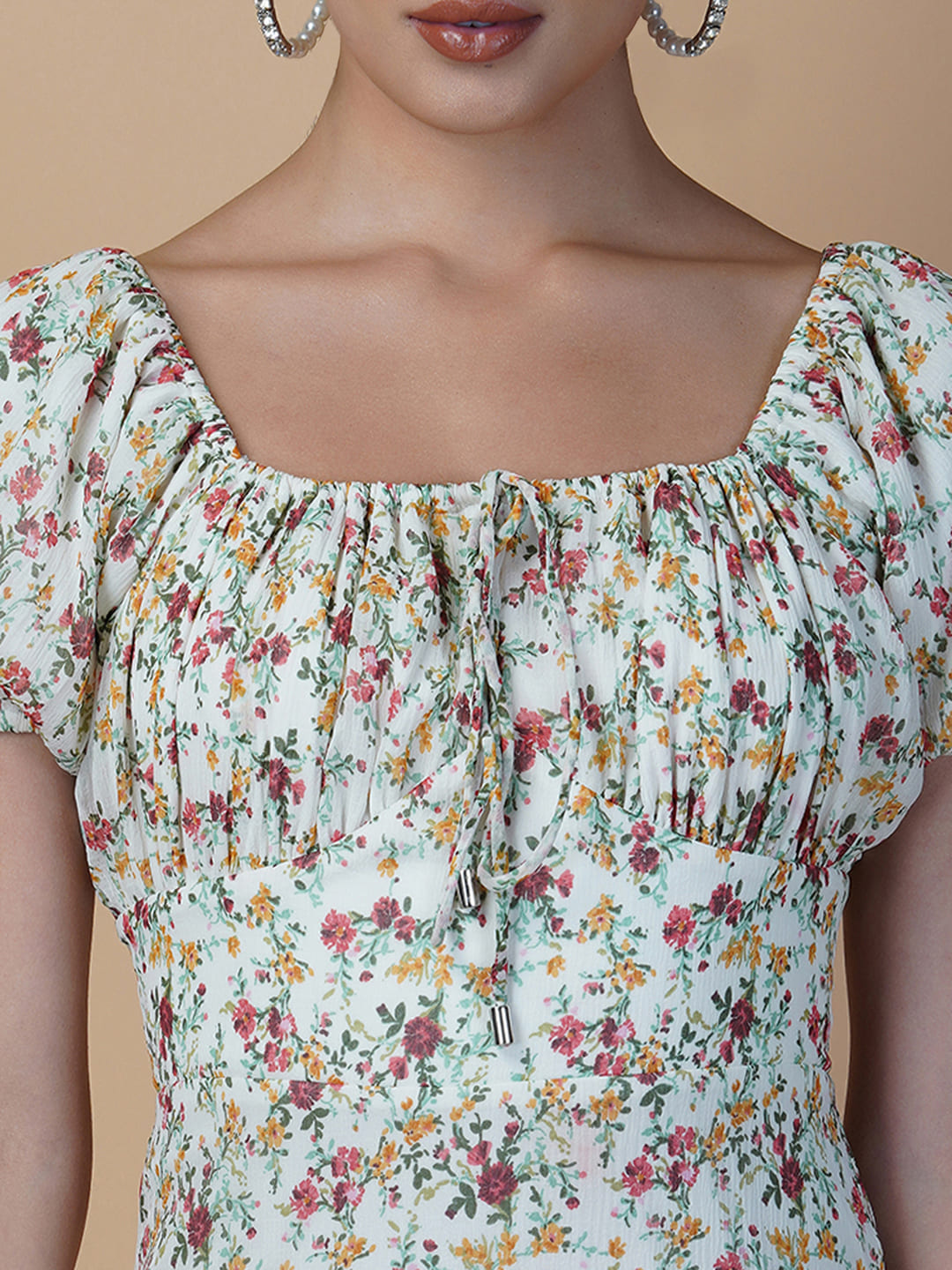 The Chiffon Printed Empire Waist Women Dress is a beautiful and elegant piece that is perfect for any special occasion. The dress features a flattering empire waist design, which accentuates the natural curves of the body, while the ruched bust adds a touch of femininity.