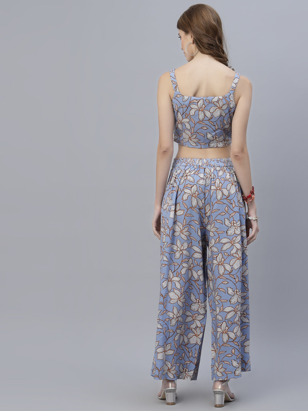 A co-ordinate set is a two-piece outfit consisting of a top and bottom that are designed to be worn together. The lavender printed co-ordinate set you mentioned comes with a strappy blouse and a pleated palazzo in women wear catogory.