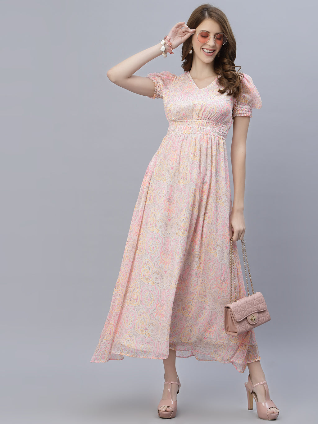 The chiffon maxi dress with a clinched waist and attached lining is a perfect choice for a formal or semi-formal event. The chiffon fabric gives the dress a flowing, elegant look, while the clinched waist adds definition and shape to the body.