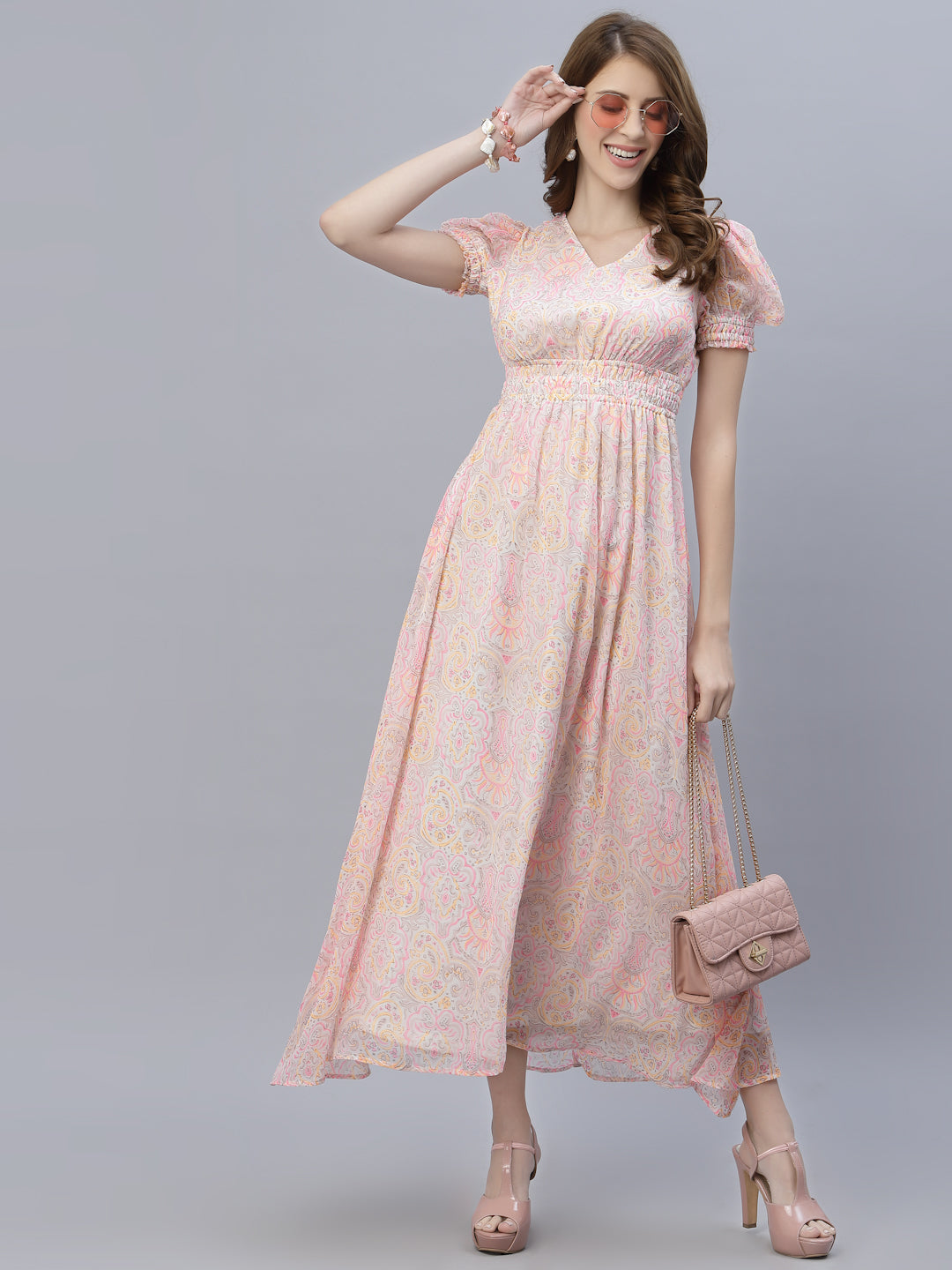 The chiffon maxi dress with a clinched waist and attached lining is a perfect choice for a formal or semi-formal event. The chiffon fabric gives the dress a flowing, elegant look, while the clinched waist adds definition and shape to the body.