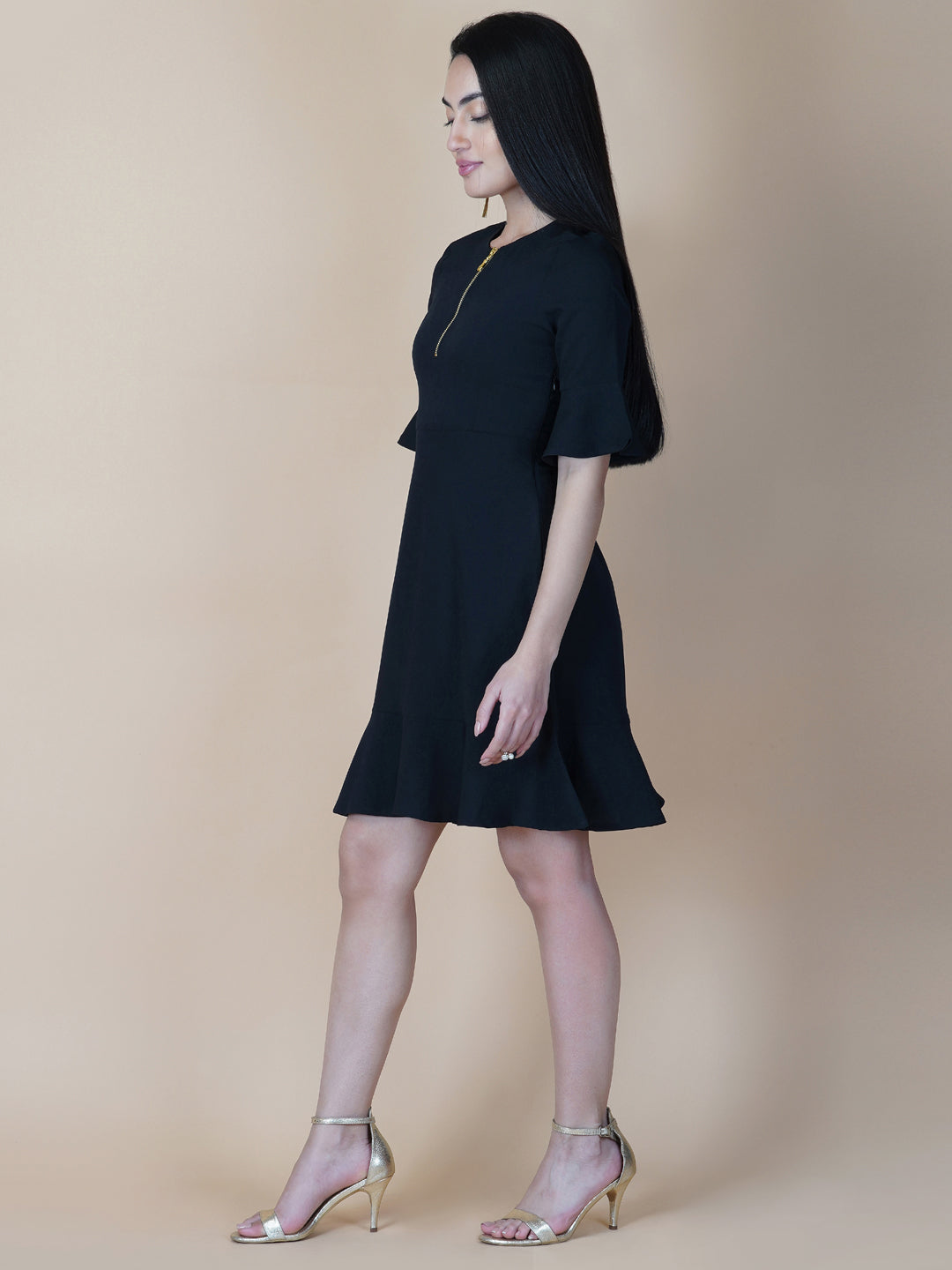 Amp up your summer style with this solid A line dress. Slip into this black short dress for an effortlessly elegant day-out ensemble. Tailored with metallic zip  and circular hem, the dress comes with a side concealed zipper for making it easy to wear .  This dress is perfect for your casual as well formal day out.  Style Tip: Complete the look with hanging earrings and a clutch