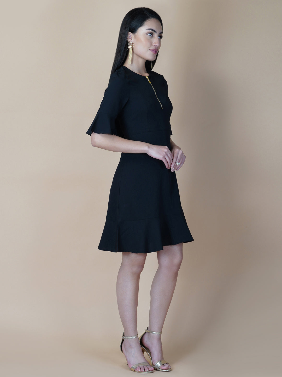 Amp up your summer style with this solid A line dress. Slip into this black short dress for an effortlessly elegant day-out ensemble. Tailored with metallic zip  and circular hem, the dress comes with a side concealed zipper for making it easy to wear .  This dress is perfect for your casual as well formal day out.  Style Tip: Complete the look with hanging earrings and a clutch