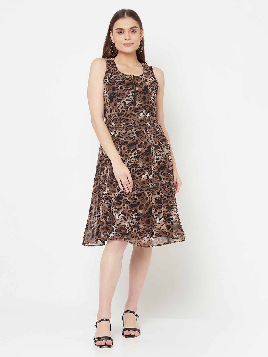Leopard Print Dress For Women With Attached Lining  Strut about town in this elegant Leopard printed dress for women. Crafted with metallic zip at front neck, the dress features a medium flare with no sleeve.  Leopard print dress for women is a type of dress that features an animal print pattern and has a flattering silhouette that follows the lines of the body, known as the "princess line." It typically falls at or below the knee, creating a midi-length hem.