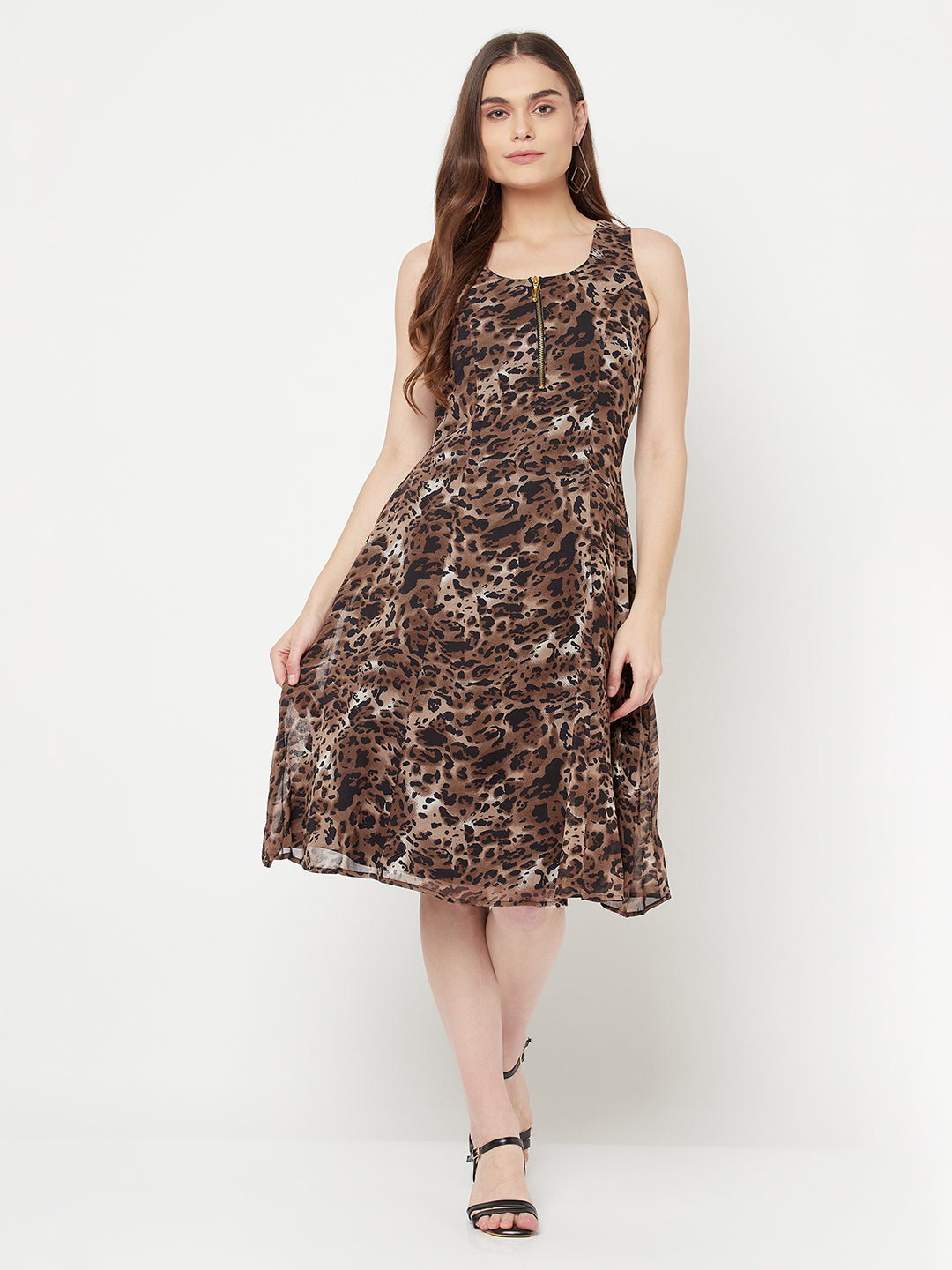 Leopard Print Dress For Women With Attached Lining  Strut about town in this elegant Leopard printed dress for women. Crafted with metallic zip at front neck, the dress features a medium flare with no sleeve.  Leopard print dress for women is a type of dress that features an animal print pattern and has a flattering silhouette that follows the lines of the body, known as the "princess line." It typically falls at or below the knee, creating a midi-length hem.