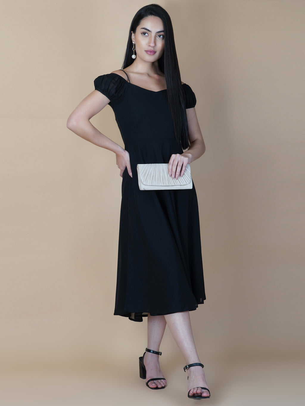 Black solid off shoulder dress features a classic and elegant design that is perfect as an evening dress. The dress is made from soft and good quality materials and is designed to fit perfectly on your body, giving you a comfortable and flattering silhouette.
