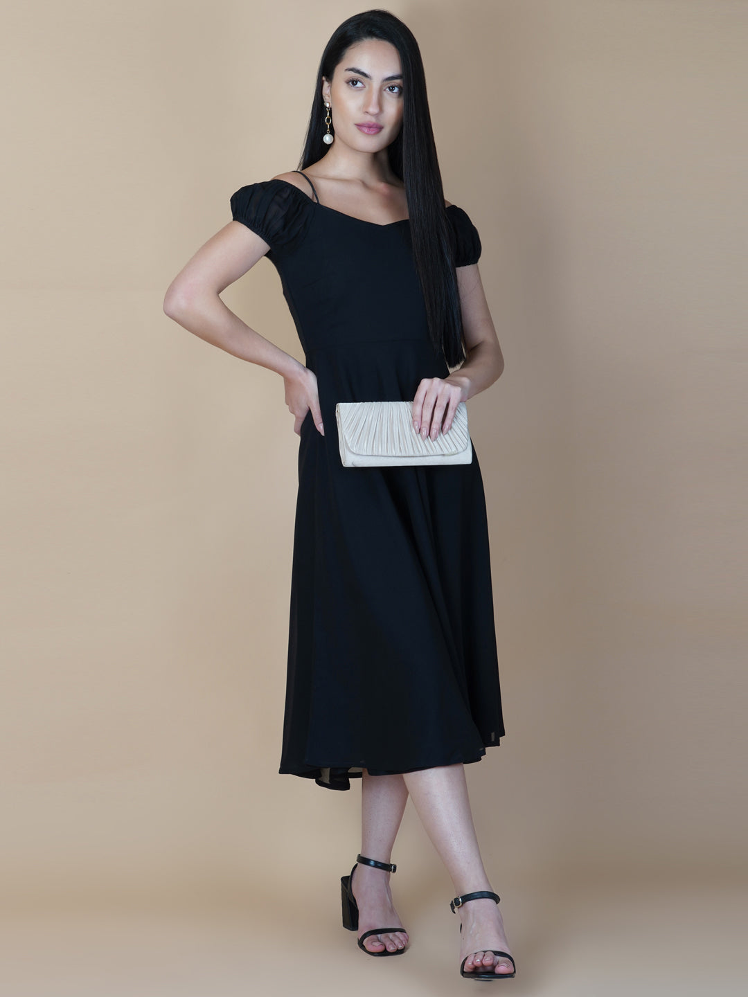 Black solid off shoulder dress features a classic and elegant design that is perfect as an evening dress. The dress is made from soft and good quality materials and is designed to fit perfectly on your body, giving you a comfortable and flattering silhouette.