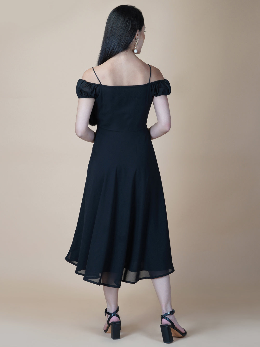 Black solid off shoulder dress features a classic and elegant design that is perfect as an evening dress. The dress is made from soft and good quality materials and is designed to fit perfectly on your body, giving you a comfortable and flattering silhouette.