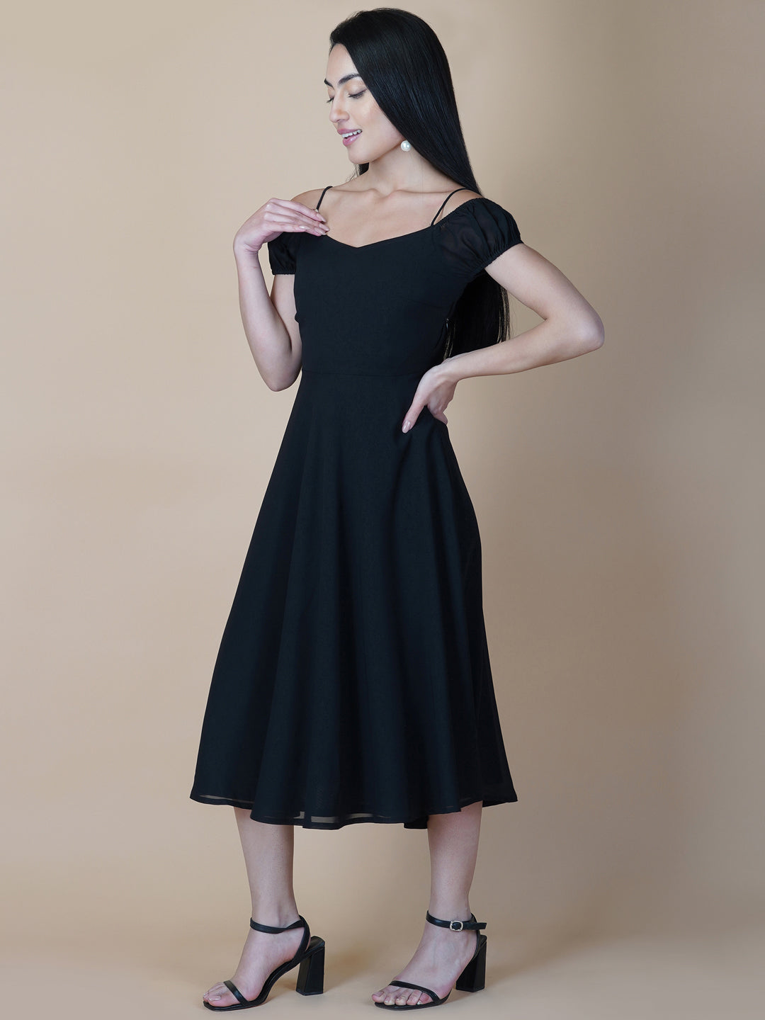Black solid off shoulder dress features a classic and elegant design that is perfect as an evening dress. The dress is made from soft and good quality materials and is designed to fit perfectly on your body, giving you a comfortable and flattering silhouette.
