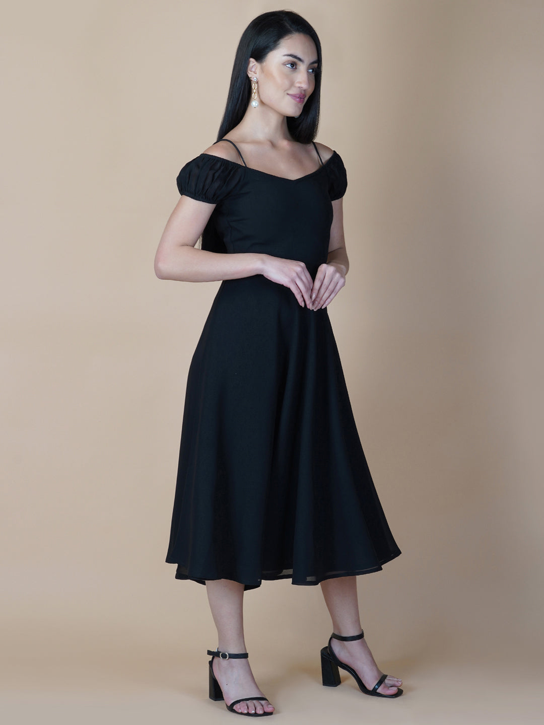 Black solid off shoulder dress features a classic and elegant design that is perfect as an evening dress. The dress is made from soft and good quality materials and is designed to fit perfectly on your body, giving you a comfortable and flattering silhouette.