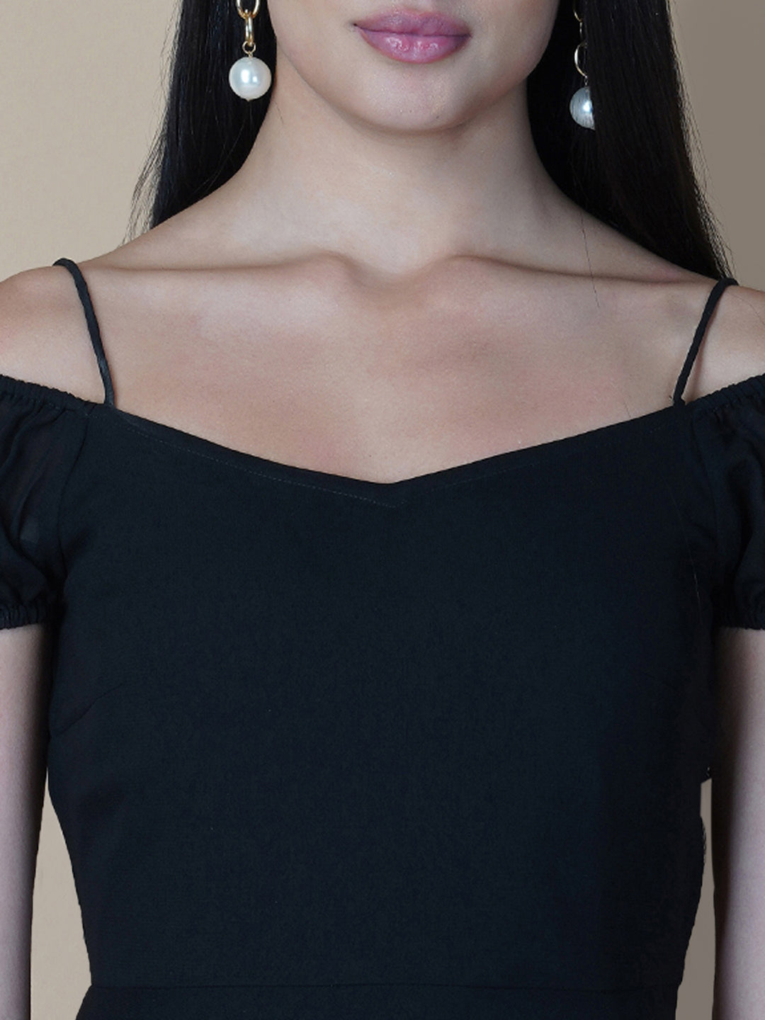 Black solid off shoulder dress features a classic and elegant design that is perfect as an evening dress. The dress is made from soft and good quality materials and is designed to fit perfectly on your body, giving you a comfortable and flattering silhouette.