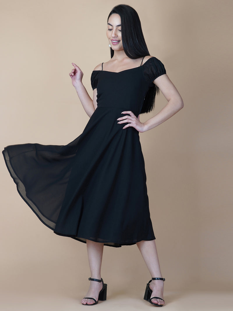 Black solid off shoulder dress features a classic and elegant design that is perfect as an evening dress. The dress is made from soft and good quality materials and is designed to fit perfectly on your body, giving you a comfortable and flattering silhouette.