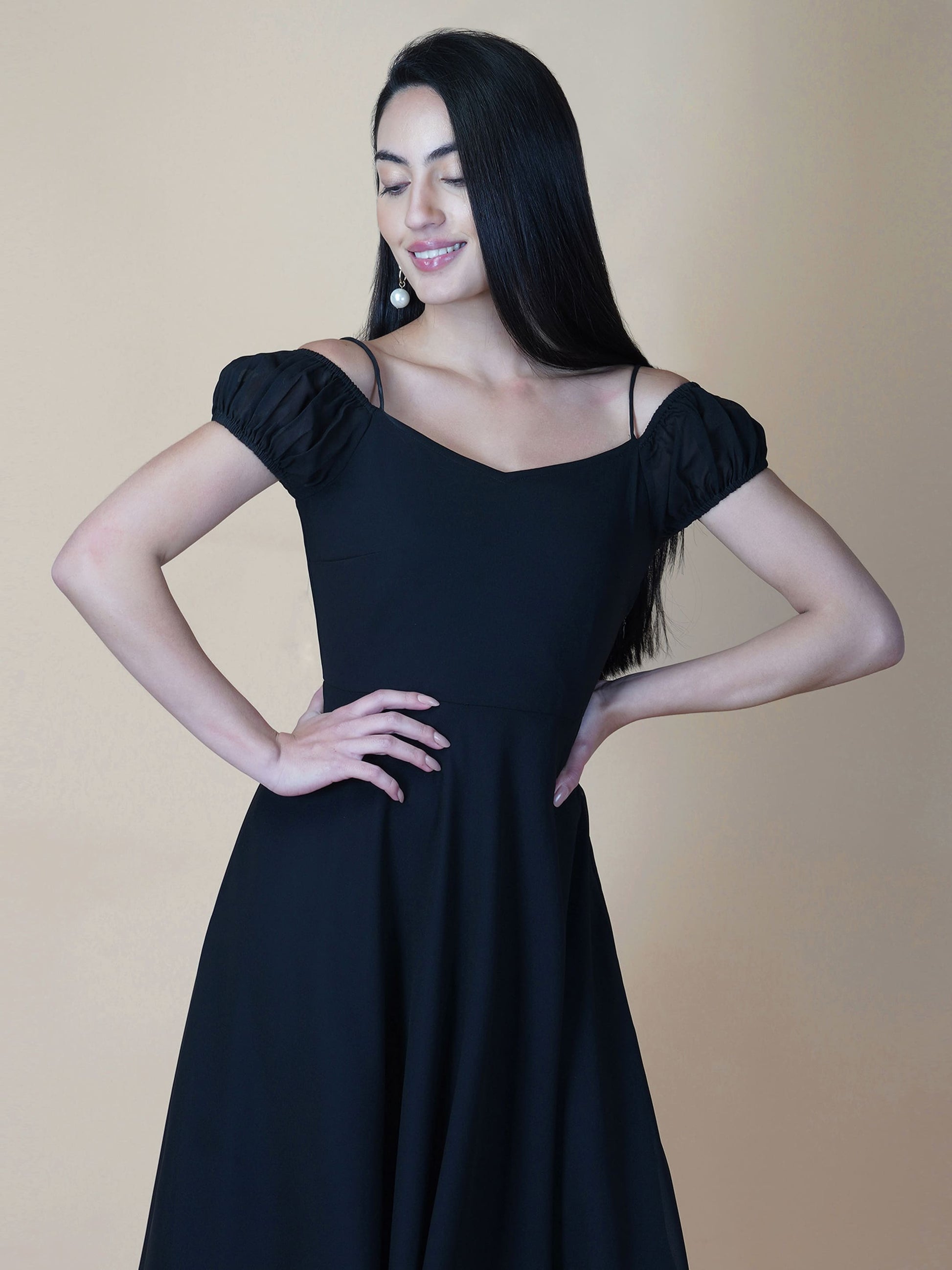 Black solid off shoulder dress features a classic and elegant design that is perfect as an evening dress. The dress is made from soft and good quality materials and is designed to fit perfectly on your body, giving you a comfortable and flattering silhouette.