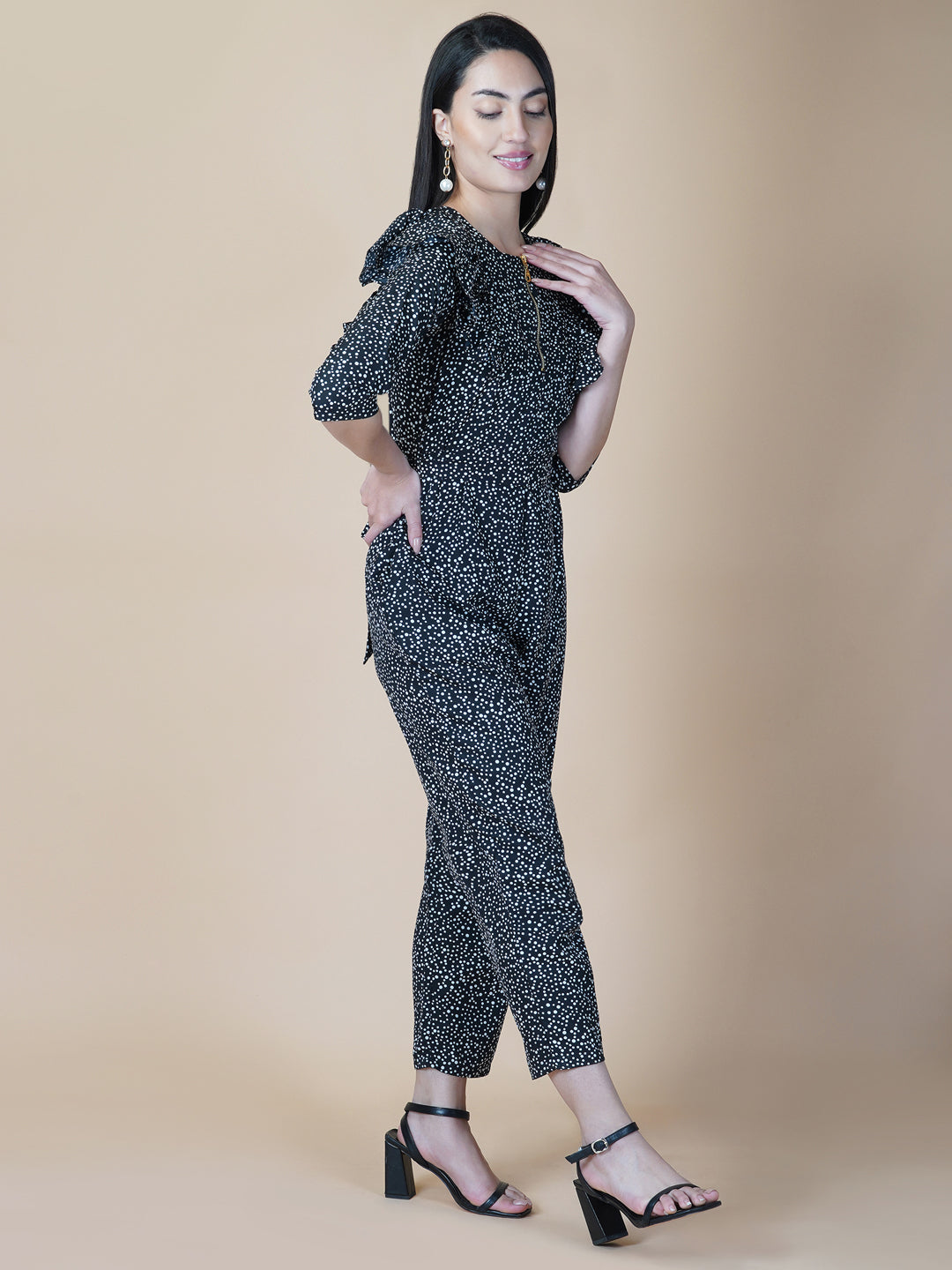 This black and white printed women jumpsuit is perfect for a stylish and chic look. The bow tie belt adds a touch of femininity, while the side ruffles add a playful element. It's made from a soft and lightweight material that's perfect for wearing all day long.