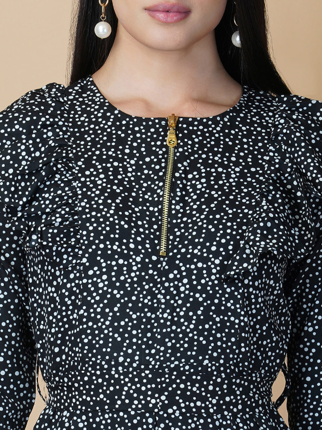 This black and white printed women jumpsuit is perfect for a stylish and chic look. The bow tie belt adds a touch of femininity, while the side ruffles add a playful element. It's made from a soft and lightweight material that's perfect for wearing all day long.
