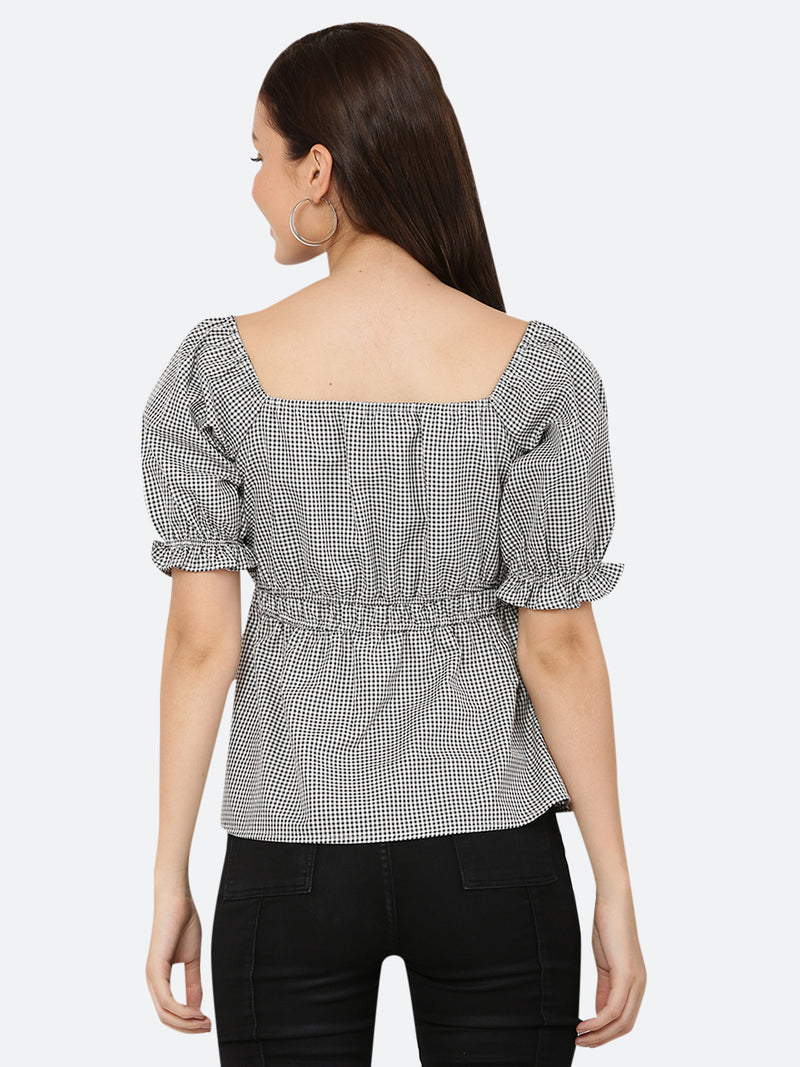 A grey gingham ruched waist women's top with gathered sleeves is a stylish and feminine garment. The top features a classic grey gingham pattern, with a fitted waistline that is gathered and ruched for a flattering silhouette. The gathered sleeves add a touch of volume and interest to the design.