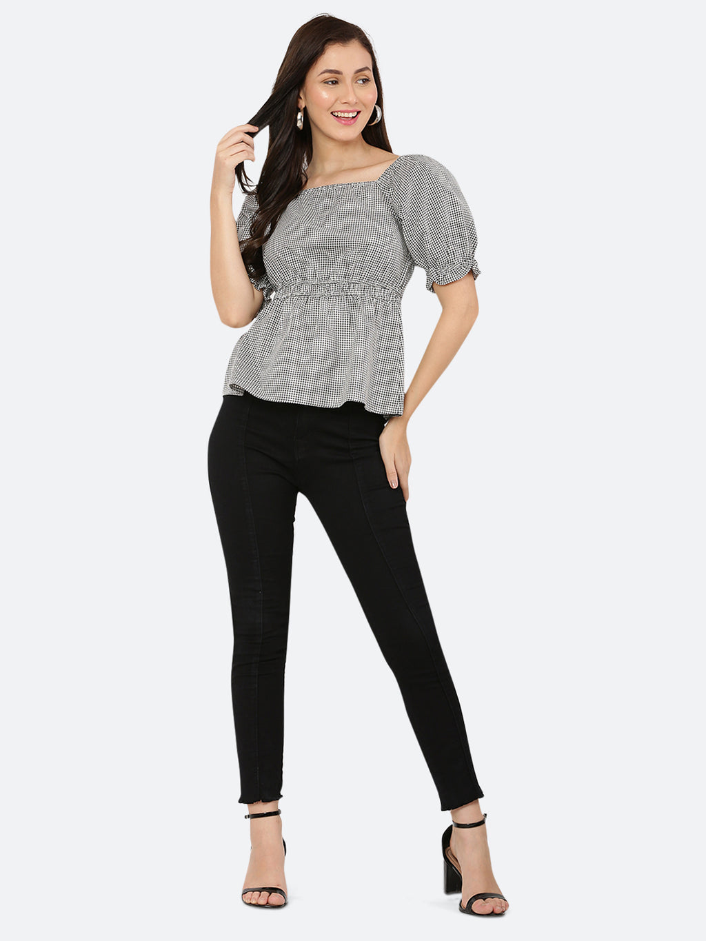 A grey gingham ruched waist women's top with gathered sleeves is a stylish and feminine garment. The top features a classic grey gingham pattern, with a fitted waistline that is gathered and ruched for a flattering silhouette. The gathered sleeves add a touch of volume and interest to the design.