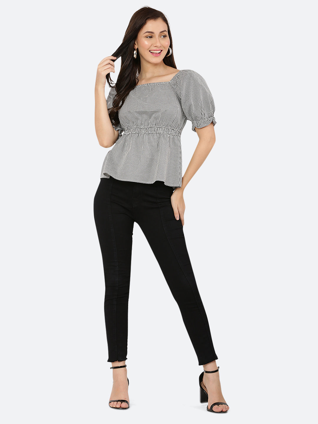 A grey gingham ruched waist women's top with gathered sleeves is a stylish and feminine garment. The top features a classic grey gingham pattern, with a fitted waistline that is gathered and ruched for a flattering silhouette. The gathered sleeves add a touch of volume and interest to the design.