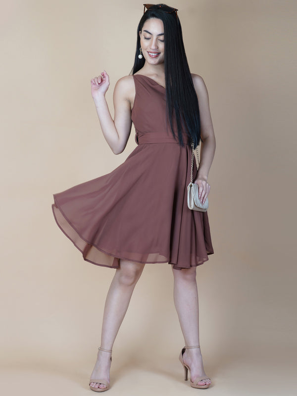 This beautiful brown color dress features a solid cowl neck design that drapes gracefully over the neckline. The circular hemline adds a unique touch to the dress, making it perfect for casual occasions.